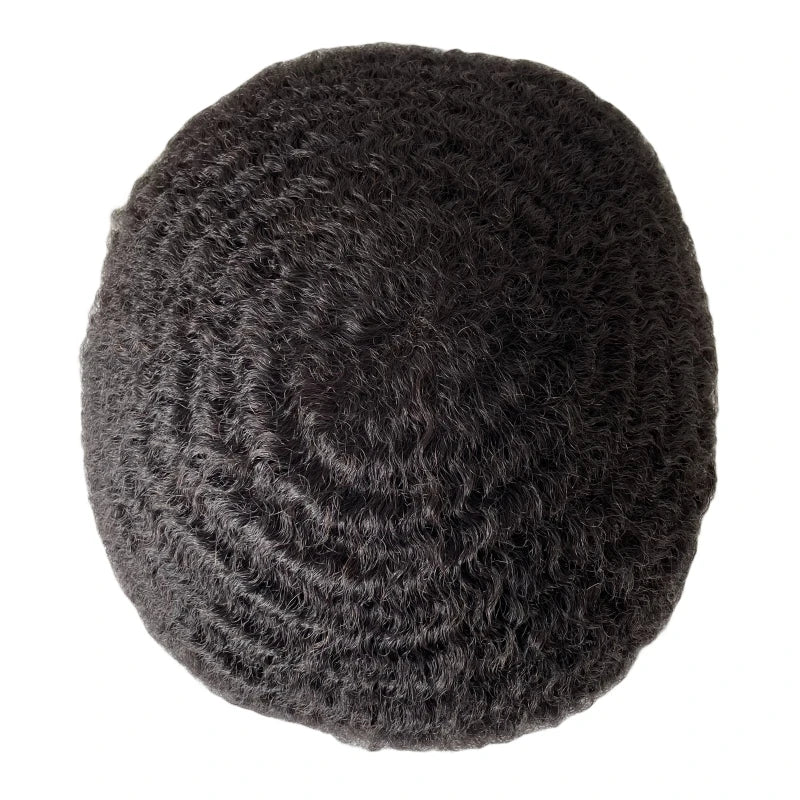 Top view of a dark textured ReHair hair system with visible waves.